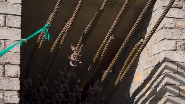 Closeup shot of metal cables supporting the Chicham bridge between Chicham and Kibber village at Spiti Valley in Himachal Pradesh, India. Support cables of the suspension bridge at Spiti Valley.