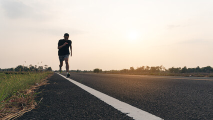 The man with runner on the street be running for exercise. Concept Starting to new year,The...