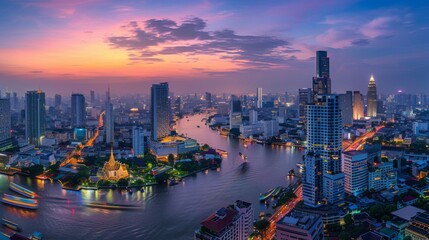 Panorama view of Bangkok city with a curve of Chao Pra Ya river at twilight.