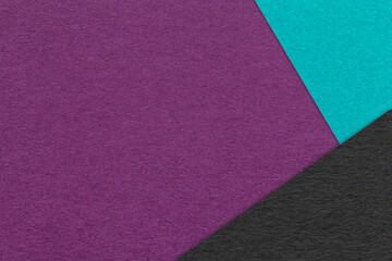 Texture of craft dark violet paper background with turquoise and black border. Vintage abstract purple cardboard.