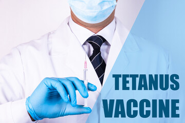 Tetanus Vaccine text is written on the background of a doctor who is holding a syringe with a...