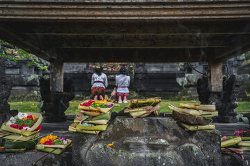 Traditional Balinese Ritual with Offerings and Incense (at Besakih Mother Temple)