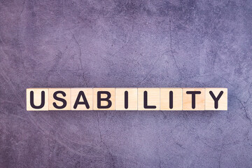 USABILITY word made with wood building blocks.