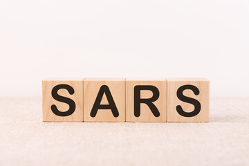 SARS word made with wood building blocks.