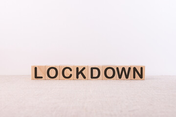 Lockdown word made with wood building blocks.