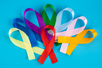 World Cancer Day February 4th. Multi-colored ribbons, symbols of the disease. Medical concept. The...