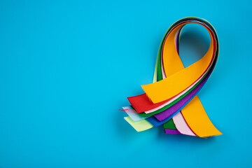 World Cancer Day February 4th. Multi-colored ribbons, symbols of the disease. Medical concept. The symbol of the struggle.