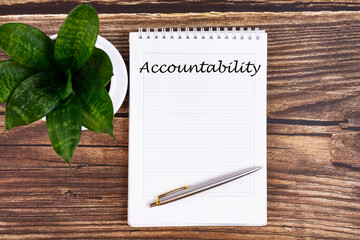 Hand writing inscription Accountability - text on notebook with a pen