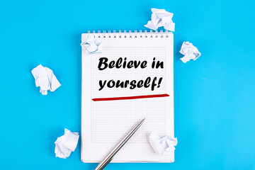 Business concept - Top view notebook writing Believe in yourself - obrazy, fototapety, plakaty