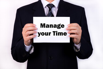 Businessman holding a card with text Manage your Time