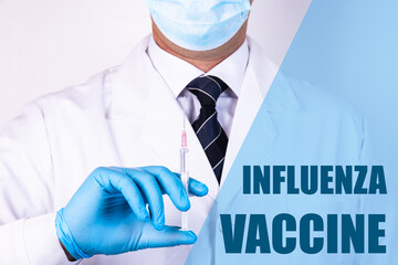 Influenza Vaccine text is written on the background of a doctor who is holding a syringe with a...