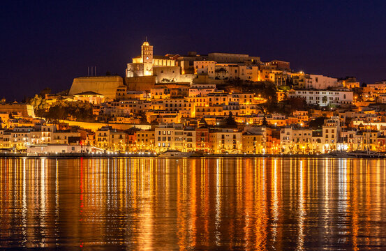View into land of Ibiza Old Town at night, Ibiza, Balearic Islands, Spain