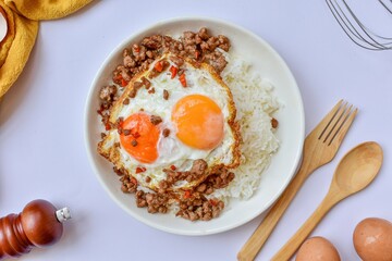 Rice with fried egg and minced pork, thai food
