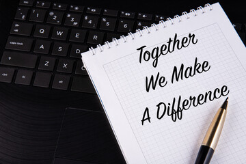 Together We Make A Difference - written on a notebook with a pen.
