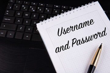 Username and password - written on a notebook with a pen.