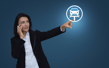 Businesswoman talking on her cell phone and pointing finger to service fix car with wrench tool icon over light blue background, Business repair car service concept