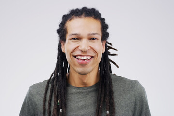 Man, portrait and laugh in studio for funny joke, comic and silly on gray background. Male person,...