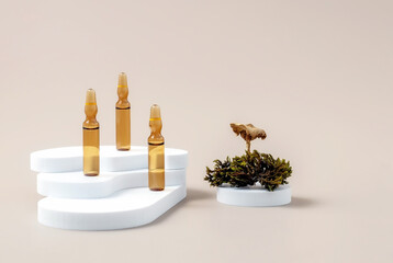 medical ampoules, moss, mushrooms and geometric shapes on a beige background