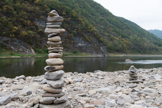 The tower of the stacked pebbles at the riverside