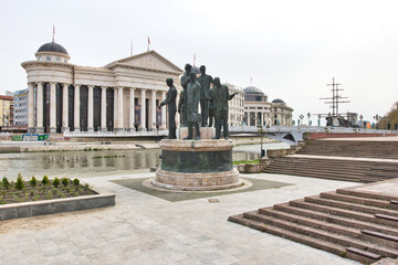 
Skopje, North Macedonia - 31.03.2024: Archaeological Museum of Macedonia and Bridge of the Civilizations in downtown of Skopje, on a sunny morning during spring. 