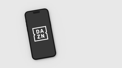 Naklejka premium Dazn Logo on Mobile Phone Screen on Gray Background with Copy Space