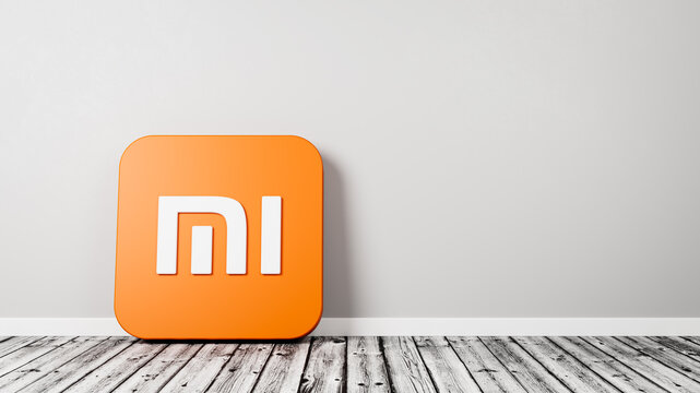 Xiaomi App Icon on Wooden Floor Against Wall