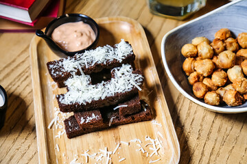 Wooden Tray With Brownies and Dipping Sauce