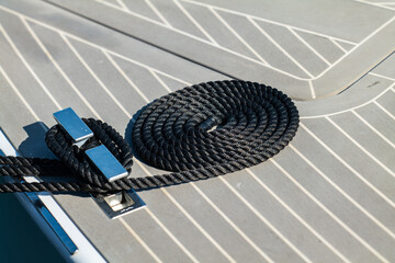 The bow of a beautiful powerboat with nice clean lines showing the deck and hatch and rope. - obrazy, fototapety, plakaty