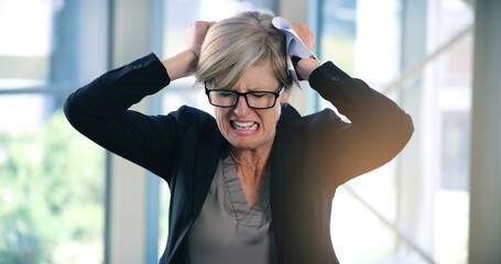 Mature woman, stress and rage in office, mental health and burnout for fail or work crisis. Female...