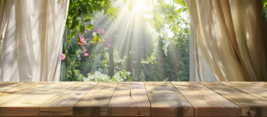 Wooden table top is clear against a blurred backdrop of curtains and a green garden view from a window. Ideal for showcasing products or creating visual design layouts.