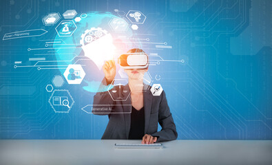 Smart business woman pointing at holographic while wearing VR goggles and sitting at table with...