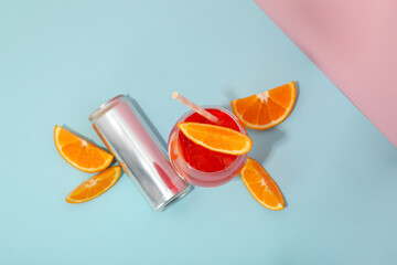 Cocktail with fresh oranges on a blue background