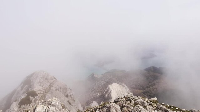Timelapse of beautiful lake, mountains and clouds. Footage from Gilbo peak in Leon.