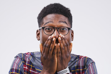 Studio background, shocked and black man in portrait with mockup space, wow and mind blown with...