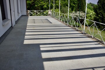 shadow on the veranda early in the morning