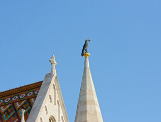 Sculpture of raven on top of Matthias church spire, Budapest.