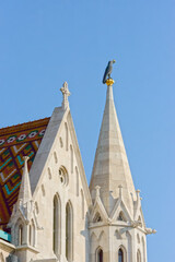 Sculpture of raven on top of Matthias church spire, Budapest.