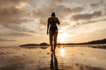 summer travel,Woman walking on the beach in the evening