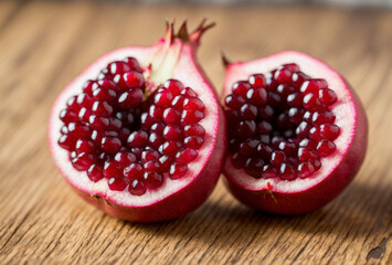 A burst pomegranate reveals its succulent seeds, each one packed with flavor and bursting with juicy goodness, a delightful explosion of taste and texture.. AI generated.