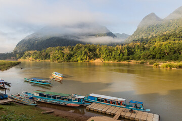 Boats at Nam Ou river in Muang Ngoi Neua village, Laos