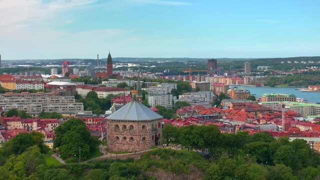 Scenic aerial view of the Old Town with Oscar Fredrik Church in the gorgeous sunset, Gothenburg, Sweden. rooftops panoramic view, Klippan port in Gothenburg harbor in afternoon, Famous bridge 