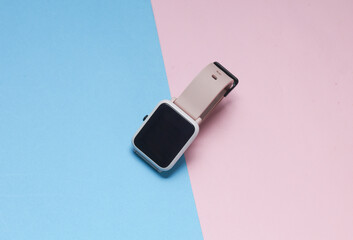 Modern smart watch on a blue-pink background
