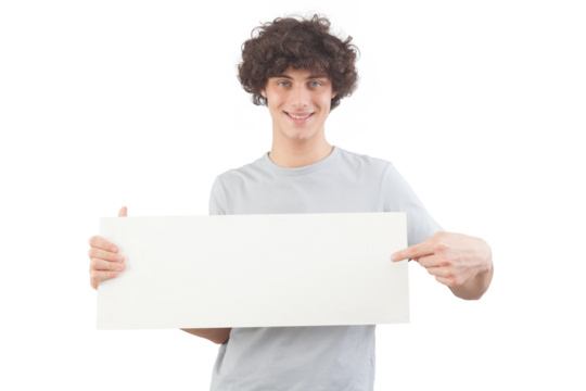 Young man, smiling and handsome, pointing with finger to show a blank white signboard, isolated on gray background. Placard copy space for text or logo, banner for advertising or promotional messages