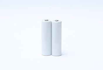 White blank aa batteries on a white background. Mockup for design