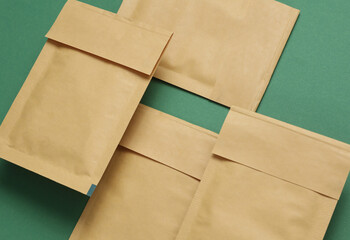 Shipping Post Parcel Envelopes on Green Background