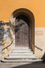 Ancient wooden door with Italian white marble staircase
