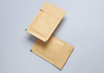 Shipping Post Parcel Envelopes Floating on Gray Background