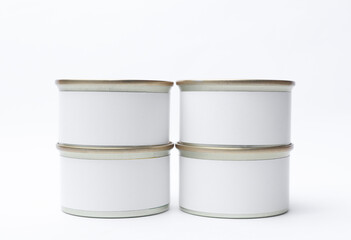 Tin cans of canned food with white labels on white background, mockup for your design