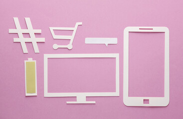 Paper-cut icons tv, smartphone, shopping cart, speech bubble, hashtag, full battery level on pink background