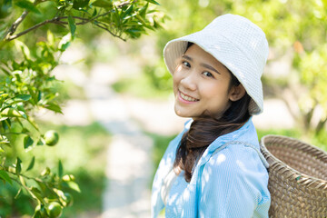 healthy cute teen girl plus size happy smiling at orange garden farm outdoor